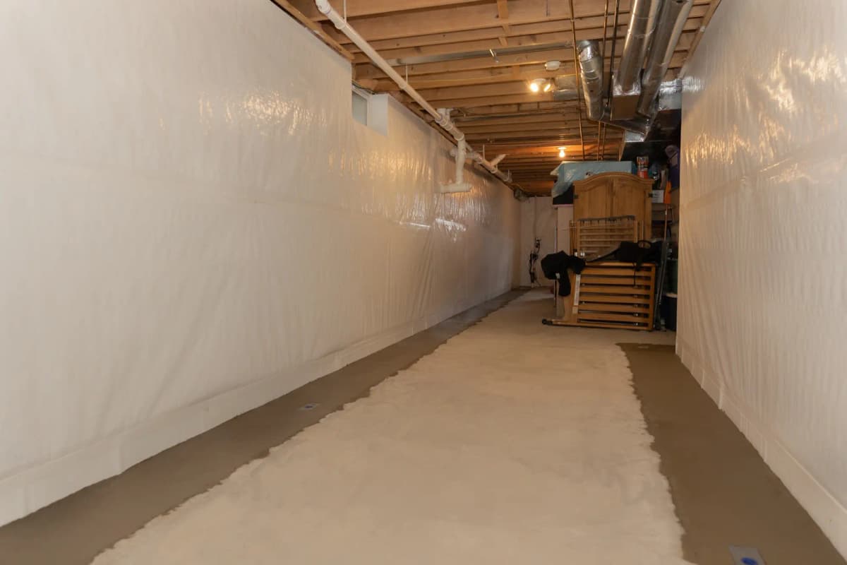 Professional basement waterproofing installation complete