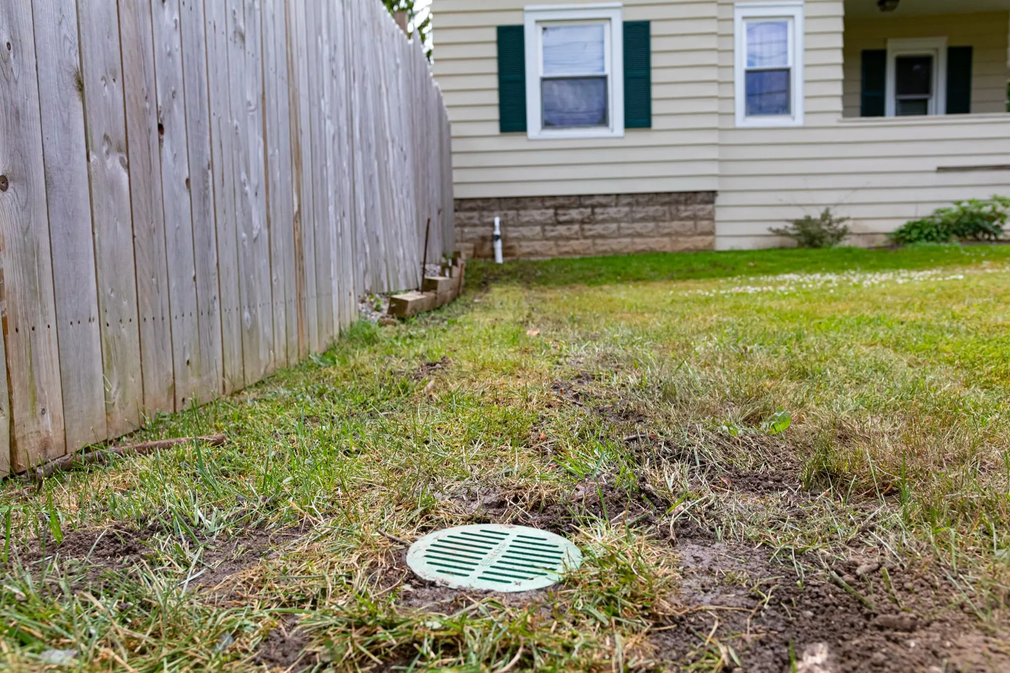 Properly installed discharge line outlet in yard