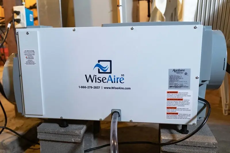 WiseAire 95 dehumidifier unit installed in basement
