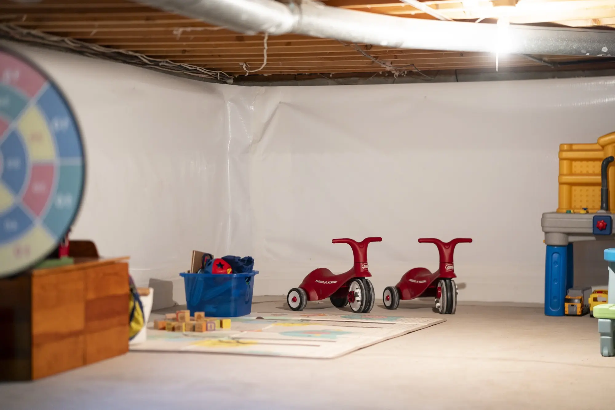 Clean, finished basement with vapor barrier installed